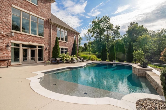 pool featuring french doors and a patio