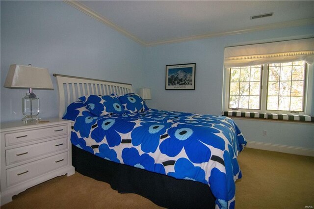 bedroom featuring visible vents, baseboards, light colored carpet, and crown molding