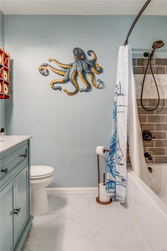 bathroom featuring toilet, vanity, baseboards, marble finish floor, and shower / bath combo with shower curtain