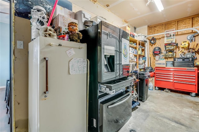 interior space featuring concrete floors and refrigerator