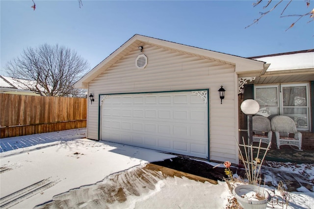 garage featuring fence