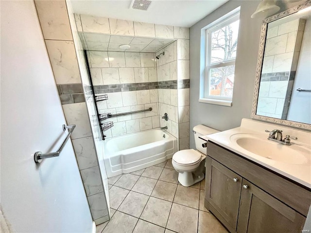 full bathroom with visible vents, toilet, washtub / shower combination, vanity, and tile patterned flooring