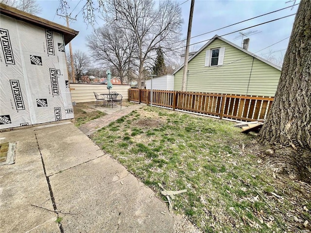 view of yard featuring a patio area and fence