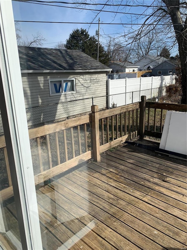 wooden terrace featuring fence