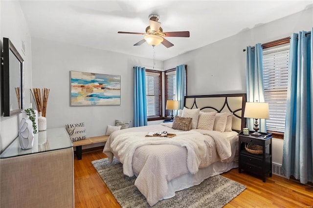 bedroom with ceiling fan and wood finished floors