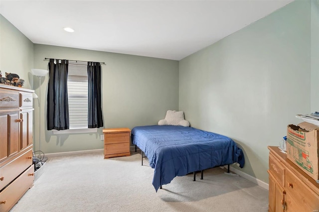 bedroom featuring carpet flooring and baseboards