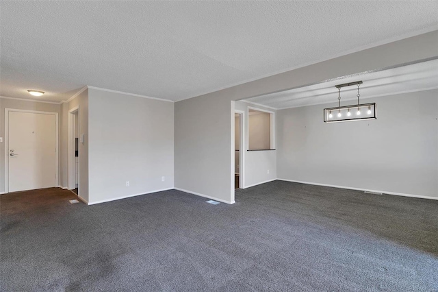 empty room with dark carpet, a textured ceiling, crown molding, and baseboards