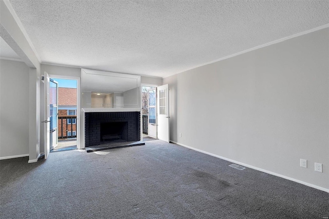 unfurnished living room with carpet flooring, baseboards, visible vents, and a wealth of natural light