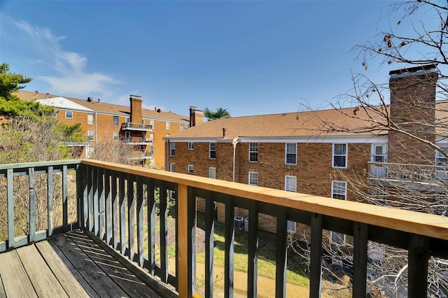 wooden deck featuring a residential view