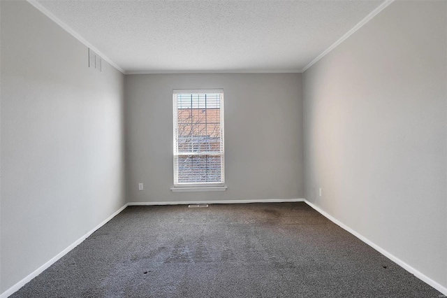 carpeted spare room with visible vents, baseboards, a textured ceiling, and crown molding