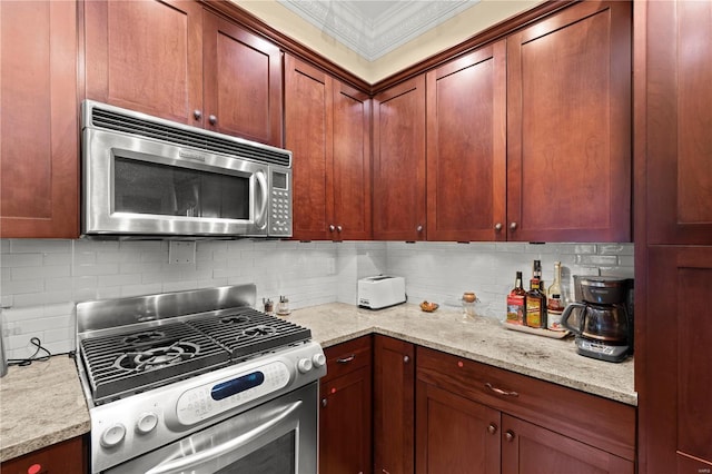 kitchen with appliances with stainless steel finishes, decorative backsplash, light stone countertops, and crown molding