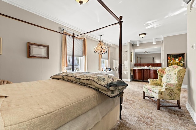 bedroom featuring a chandelier, crown molding, and a sink