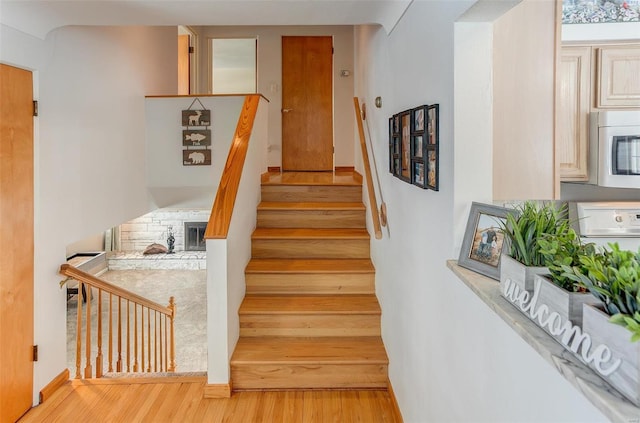 staircase featuring wood finished floors