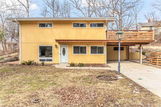 view of front of property with a carport and a deck