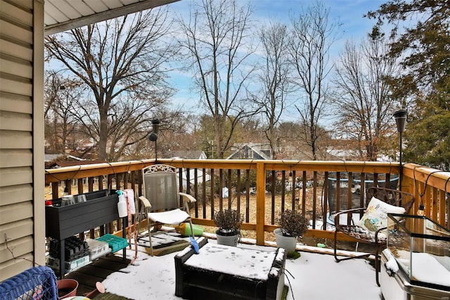 view of snow covered deck