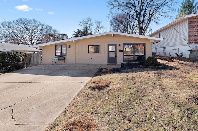 view of front of property featuring fence