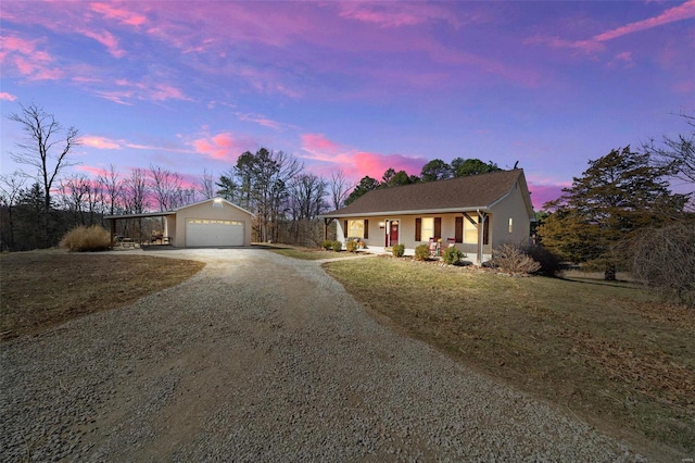 single story home with covered porch and driveway