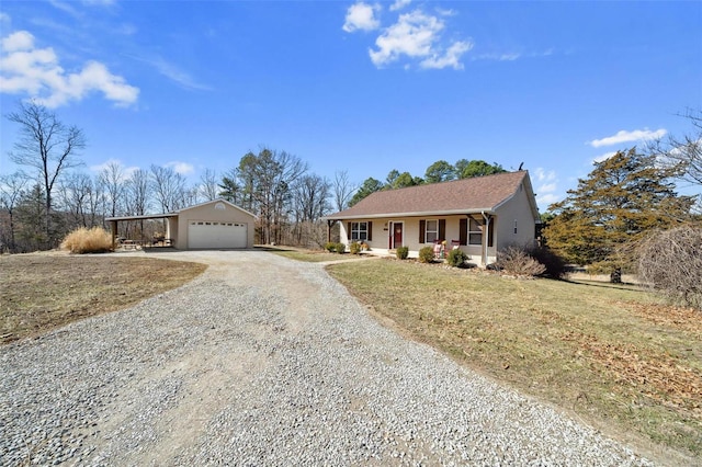 single story home with a garage, driveway, and a porch