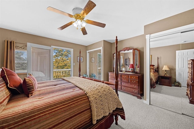 bedroom with access to outside, a closet, carpet flooring, and a ceiling fan