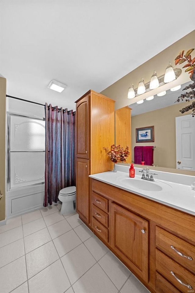 full bathroom featuring toilet, tile patterned flooring, vanity, and a shower with curtain