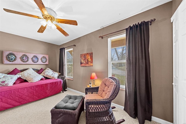 bedroom featuring carpet, a ceiling fan, and baseboards