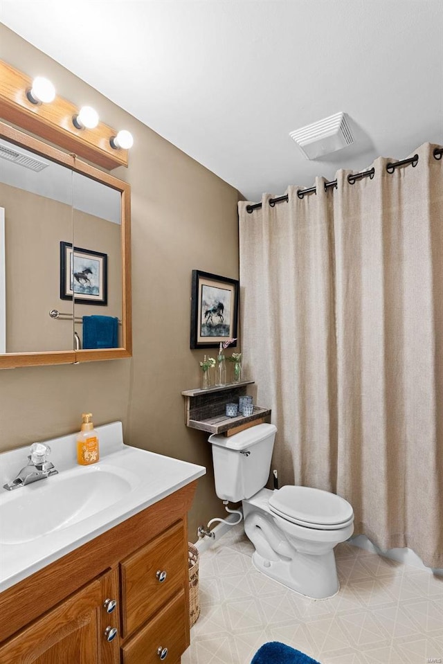 full bathroom featuring toilet, tile patterned floors, visible vents, and vanity