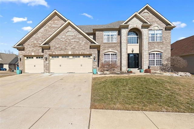 view of front of home featuring a garage, driveway, and brick siding