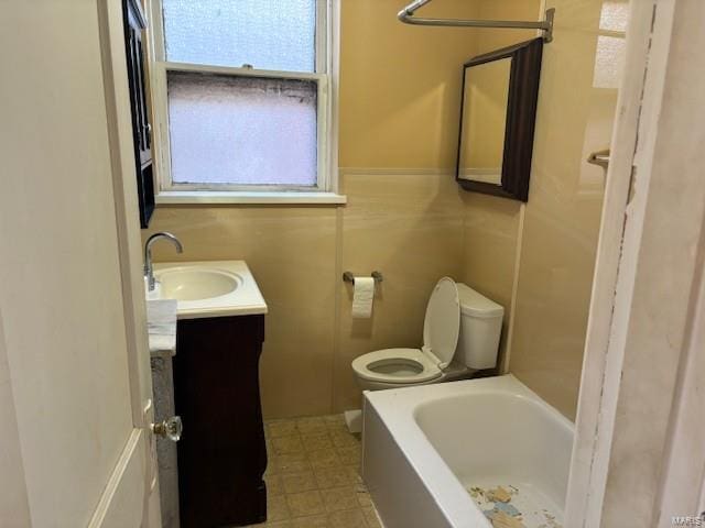 bathroom featuring toilet, a washtub, walk in shower, and vanity