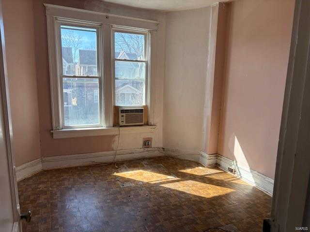 spare room featuring baseboards