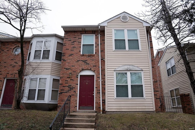 view of front of property with brick siding