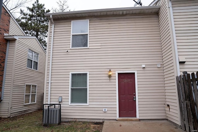 rear view of house with central air condition unit