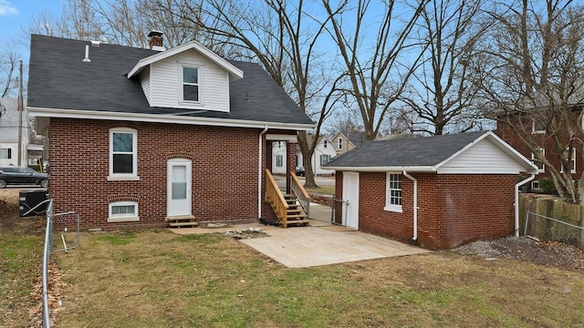 rear view of property with entry steps, a patio, fence, central AC, and brick siding