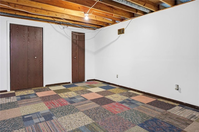 unfinished basement featuring carpet floors and baseboards