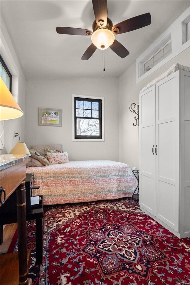 bedroom featuring a ceiling fan and vaulted ceiling