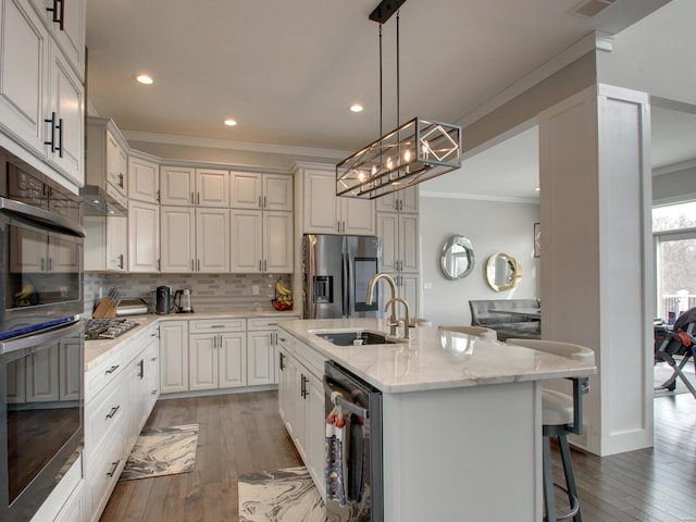 kitchen with dishwashing machine, a kitchen island with sink, white cabinetry, stainless steel refrigerator with ice dispenser, and a sink