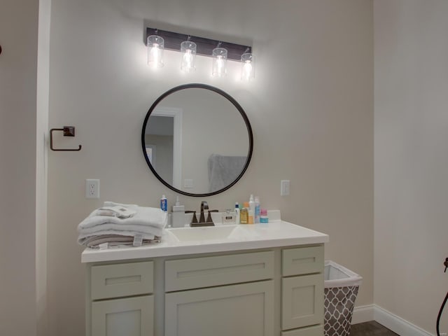 bathroom with vanity and baseboards