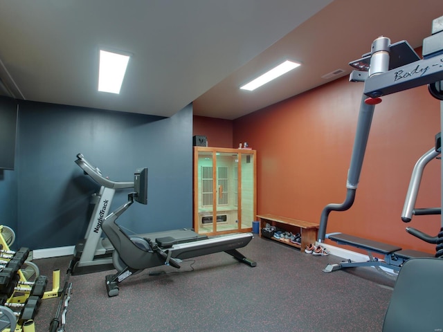 exercise area with visible vents and baseboards