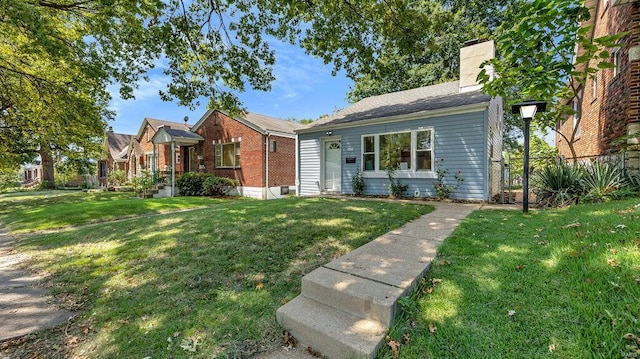 bungalow-style home featuring a front yard, fence, and a chimney