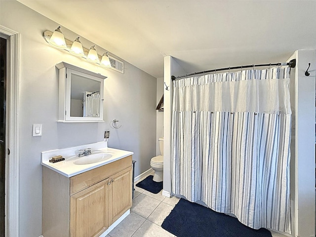 full bathroom featuring toilet, curtained shower, vanity, and tile patterned floors