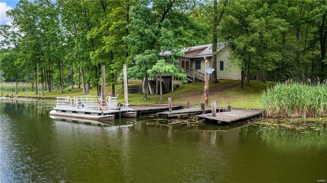 view of dock featuring stairs and a water view
