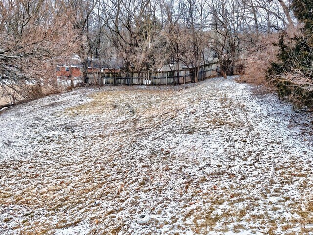 view of yard layered in snow