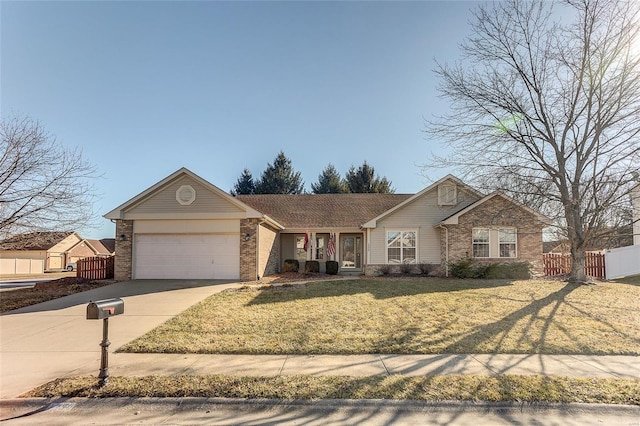 view of front facade with brick siding, concrete driveway, an attached garage, a front yard, and fence