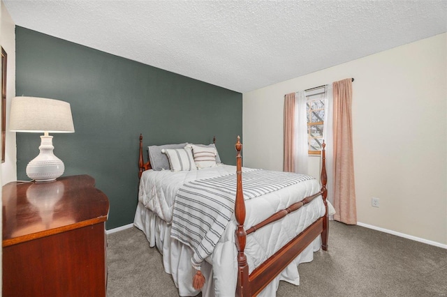 bedroom featuring a textured ceiling, carpet floors, and baseboards