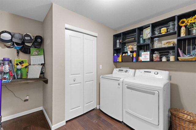 washroom with laundry area, baseboards, dark wood-type flooring, and washer and dryer