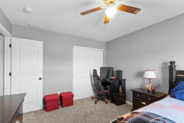 bedroom featuring light carpet, ceiling fan, a closet, and visible vents