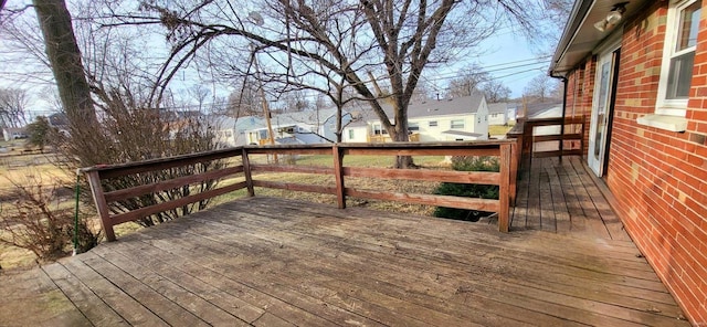 wooden terrace with a residential view