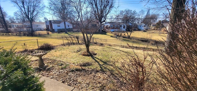 view of yard with fence and a residential view