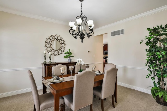 dining space with baseboards, ornamental molding, visible vents, and light colored carpet