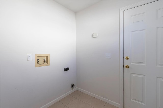 laundry room with light tile patterned floors, hookup for an electric dryer, laundry area, washer hookup, and baseboards