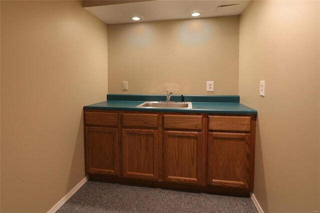 interior space with recessed lighting, vanity, and baseboards